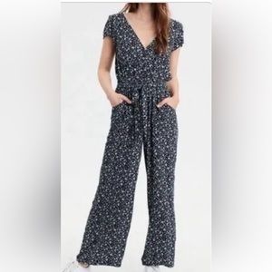 American Eagle navy blue jumpsuit white flowers cap sleeves